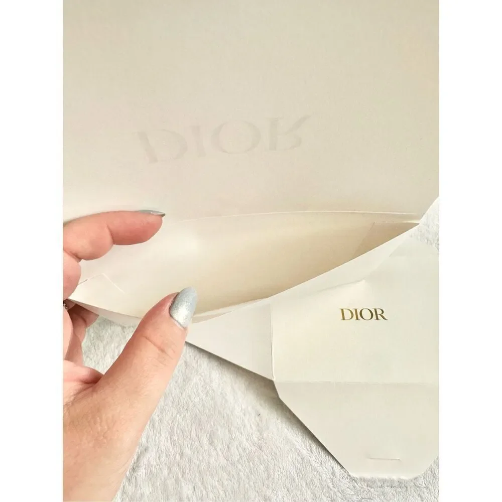White and gold Dior envelope ￼